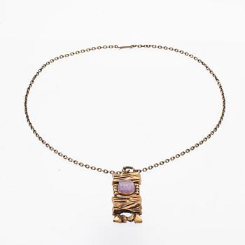 A bronze necklace set with an amethyst by Pentti Sarpaneva.