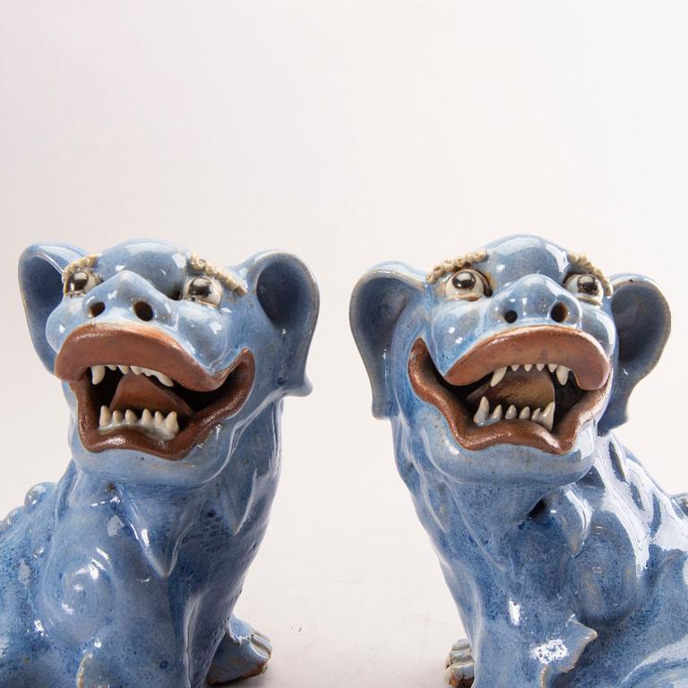 A pair of Chinese 19th century glazed Fo-dogs.