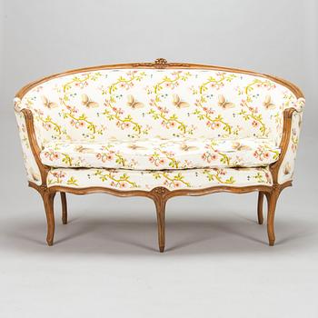 A French, mid-18th-century Louis XV sofa.