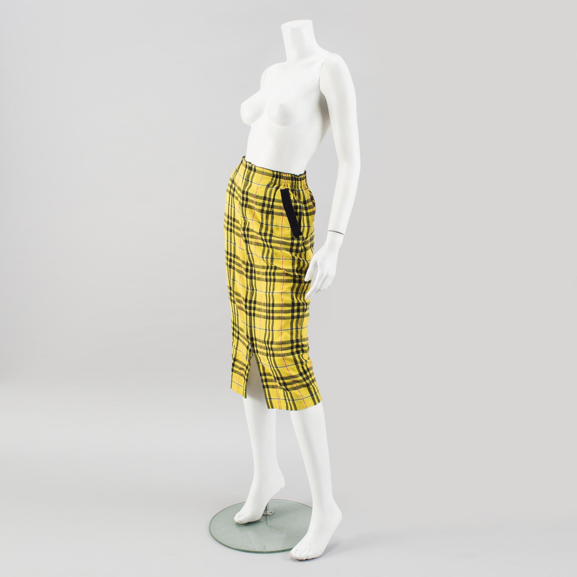 A checkered skirtby Jean Paul Gaultier.