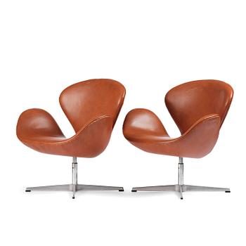 79. Arne Jacobsen, a pair of "Swan" chairs, Fritz Hansen, Denmark, 1980.