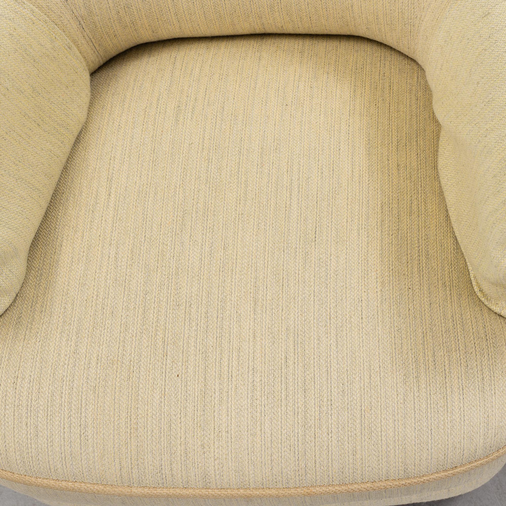 A pair of second half of the 20th century 'Hemmakväll' easy chairs by Carl Malmsten.