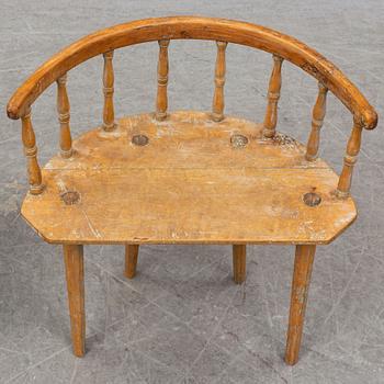 a swedish wooden chair with a stool from the 19th century.