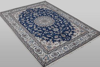 A carpet, Nain, part silk, ca 294 x 198 cm.