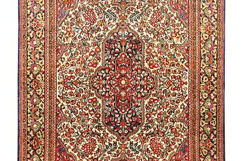 A Ghom rug, c. 202 x 137 cm.
