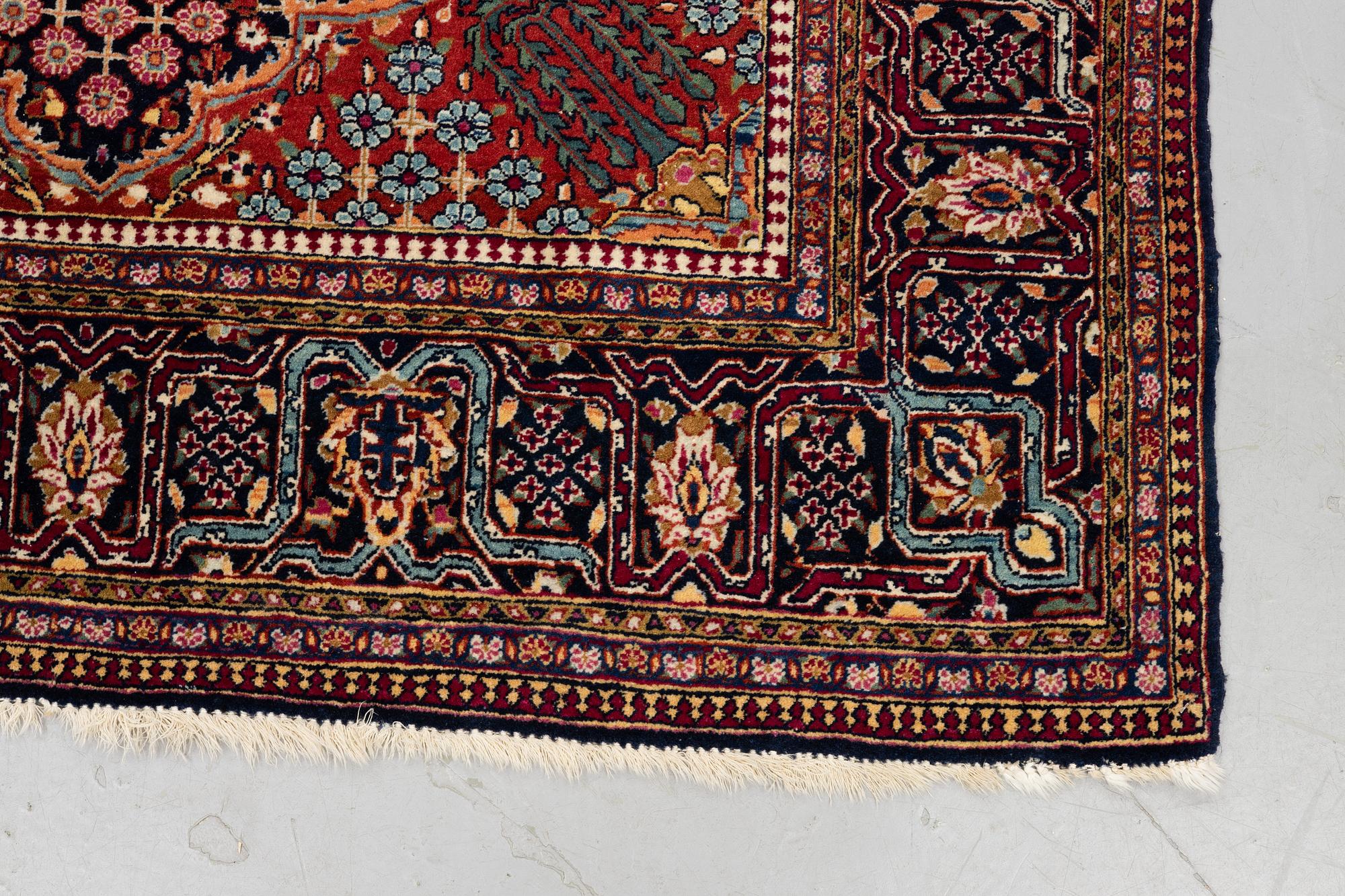 A rug, semi-antique Kashan, ca 216,5 x 140 cm.