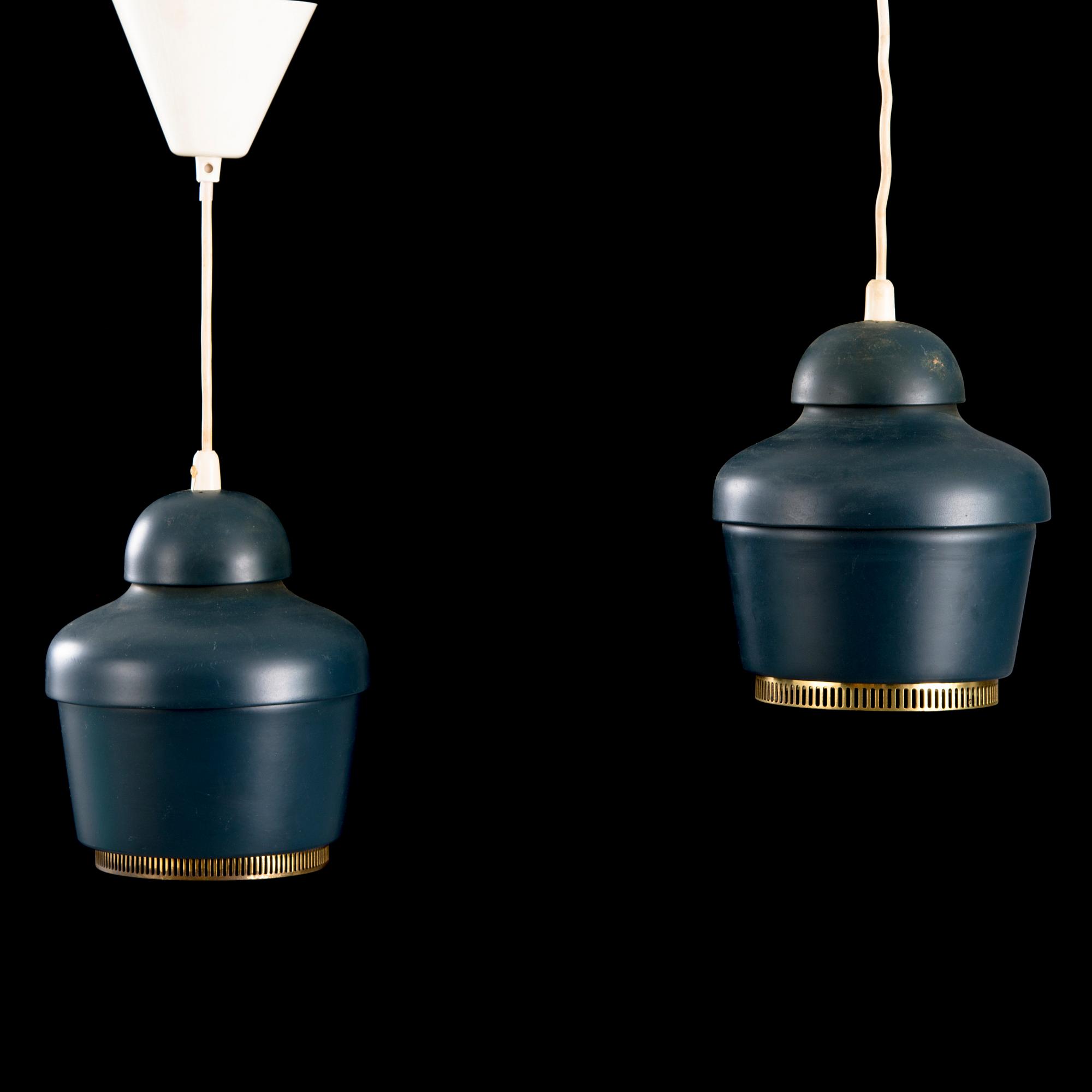 A pair of 'A330' ceiling lamps for Valaistustyö.