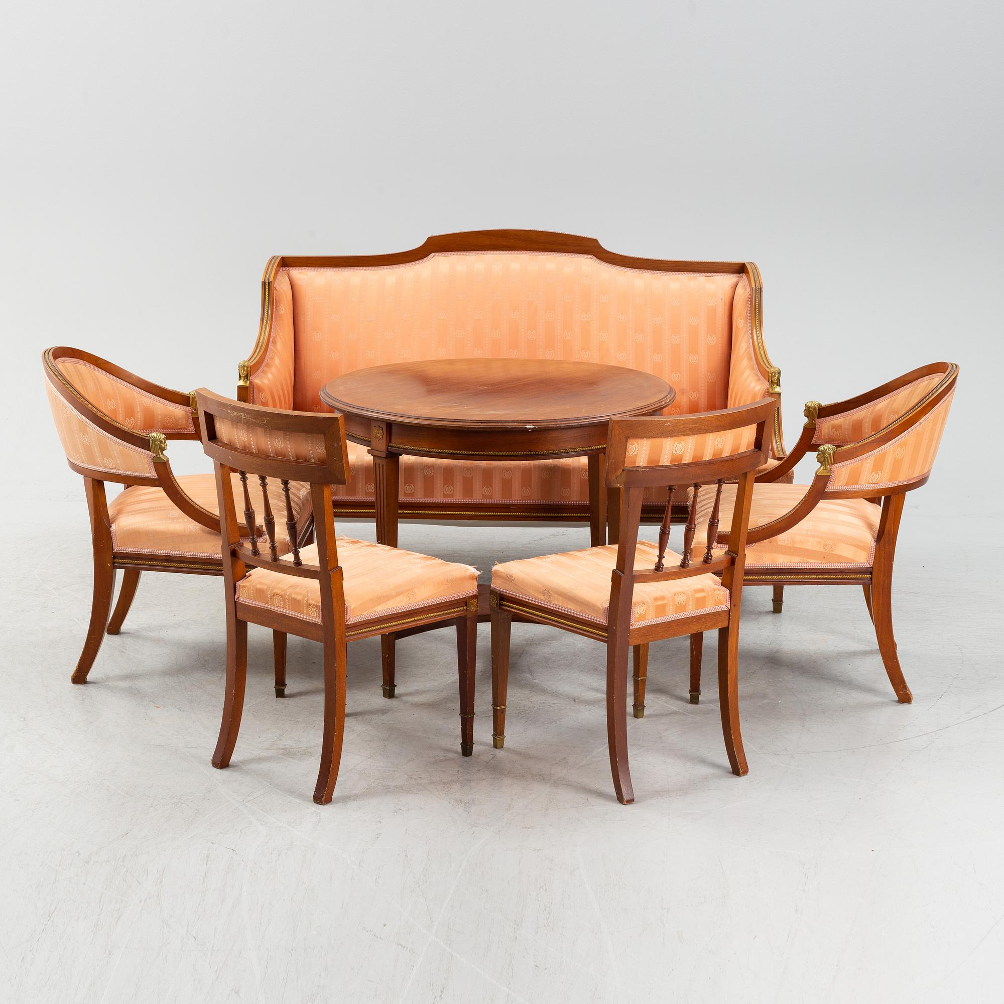 An Empire style table, a sofa and eight chairs, early 20th Century.