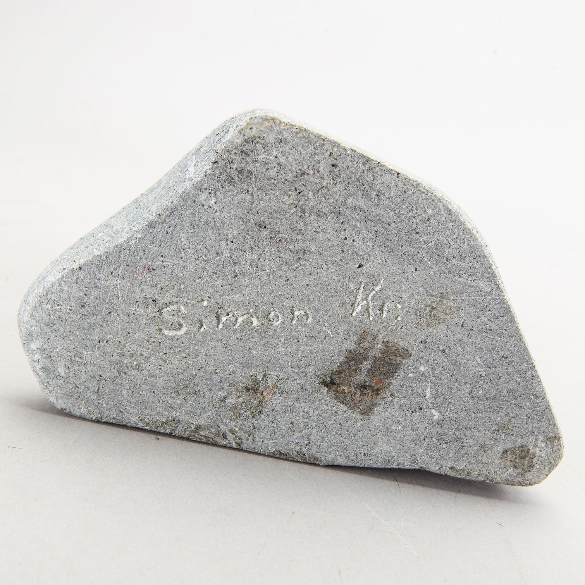 A simon Kristofferson signed stone figurine.