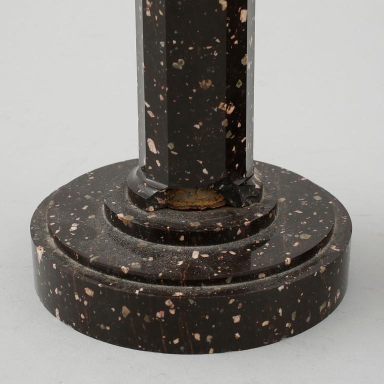 A pair of late Gustavian early 19th century porphyry and ormolu candlesticks.