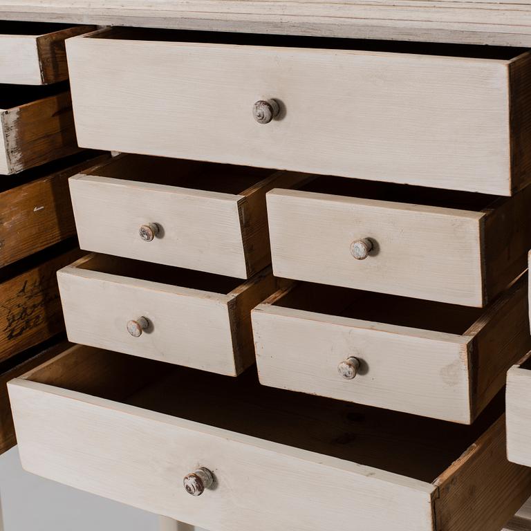 A CHEST OF DRAWERS.