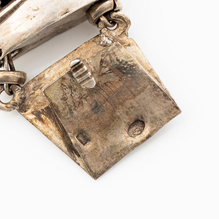 Silver necklace.
