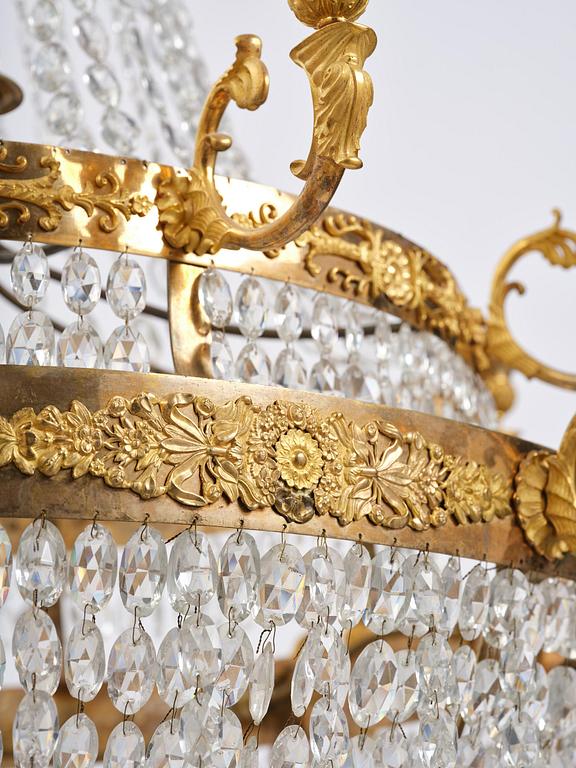 An ormolu and cut glass sixteen-branch Empire chandelier, Paris, early 19th century.