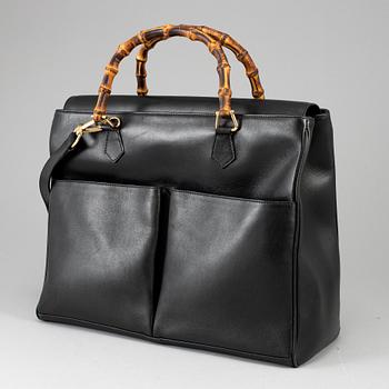 GUCCI, a leather bag/briefcase.