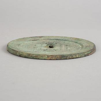 A bronze mirror, Xin-Eastern Han dynasty (9-220).