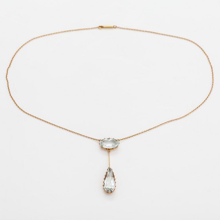 An 18K gold necklace with aquamarines.