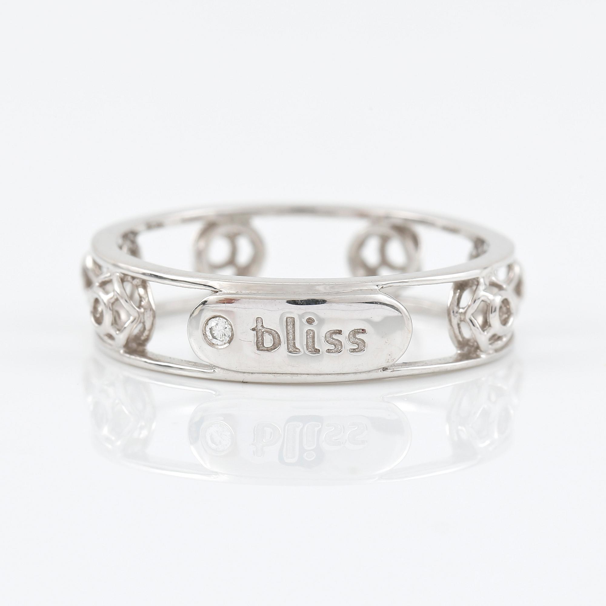 RING, Bliss, Italien. genombruten 18K vitguld med diamant på logoplatta 0.007ct.