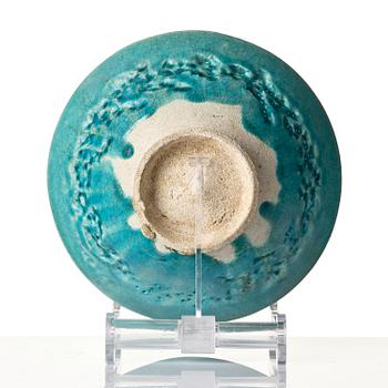 A Kashan Turquoise glazed conical pottery bowl, central Persia, 13th century.