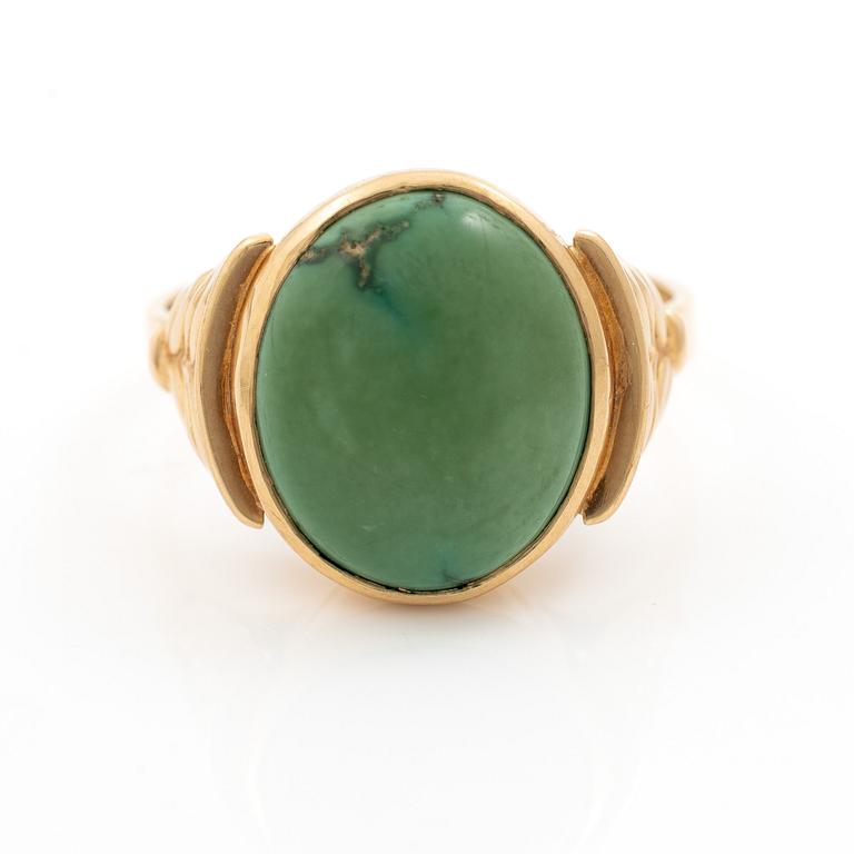 18K gold ring with green stone.