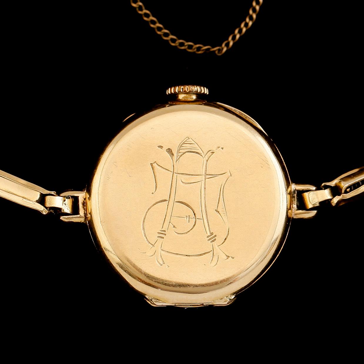 DAMARMBANDSUR, 18 k guld med armband, 20 k guld, 1900-talets första hälft. Total vikt med urverk ca 13 gram.