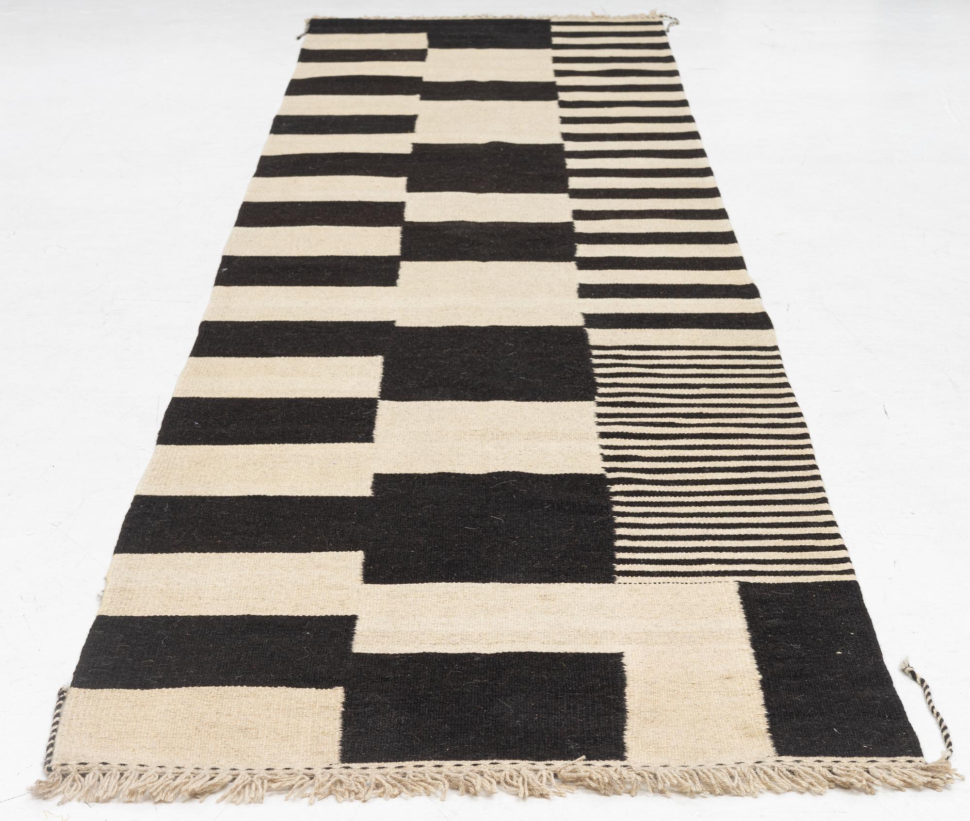 A kilim runner, c. 393 x 93 cm.