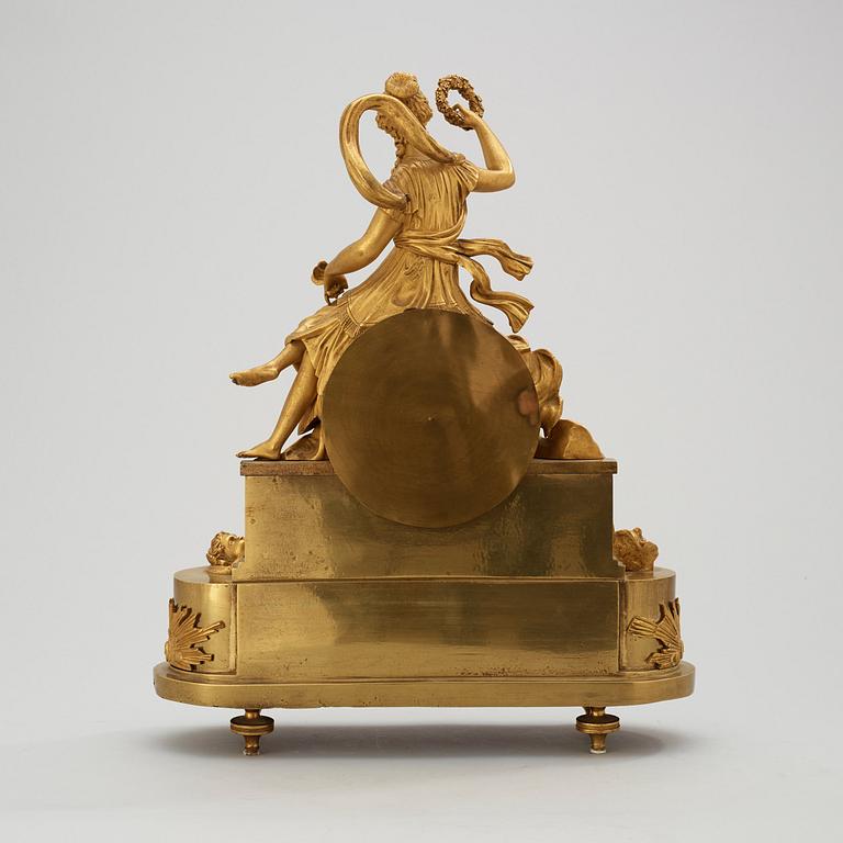 A French Empire early 19th century gilt bronze mantel clock.