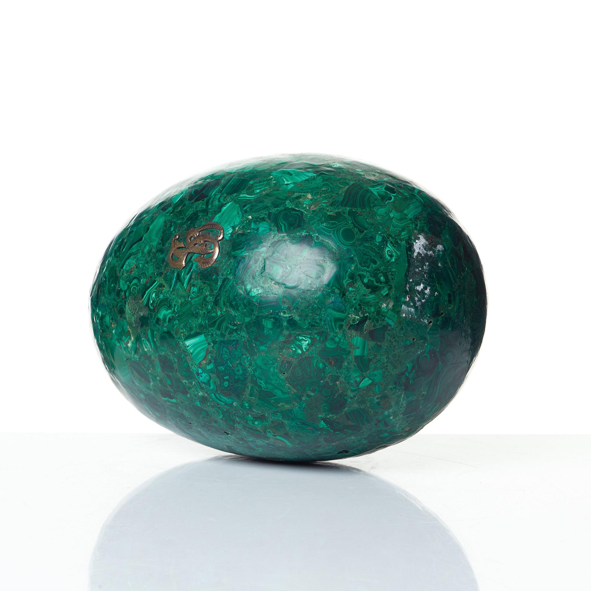 A Russian 19th Century malachite veneered egg.