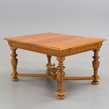 An oak Baroque-style dining table, around 1900.