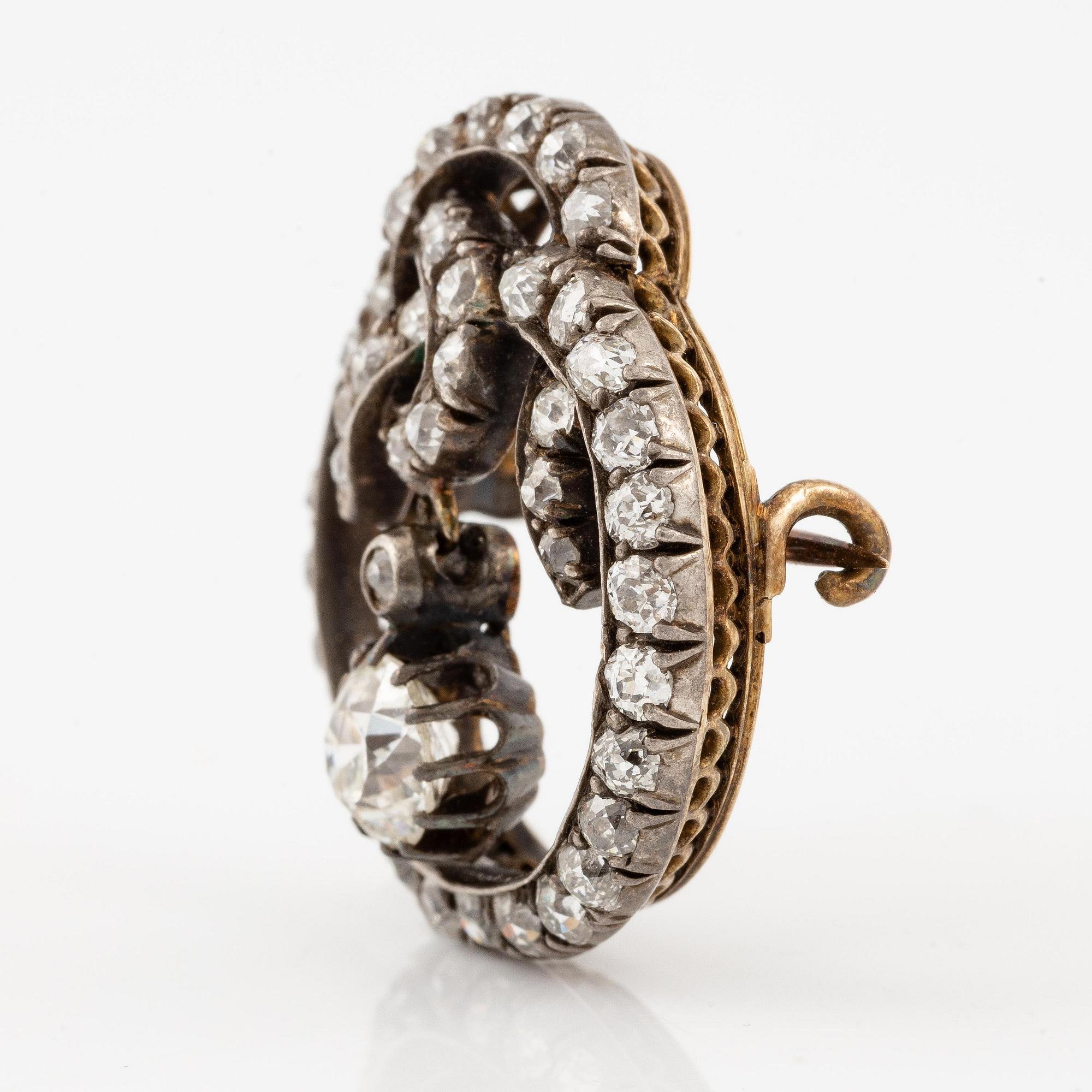 A brooch, silver and gold set with old-cut diamonds.