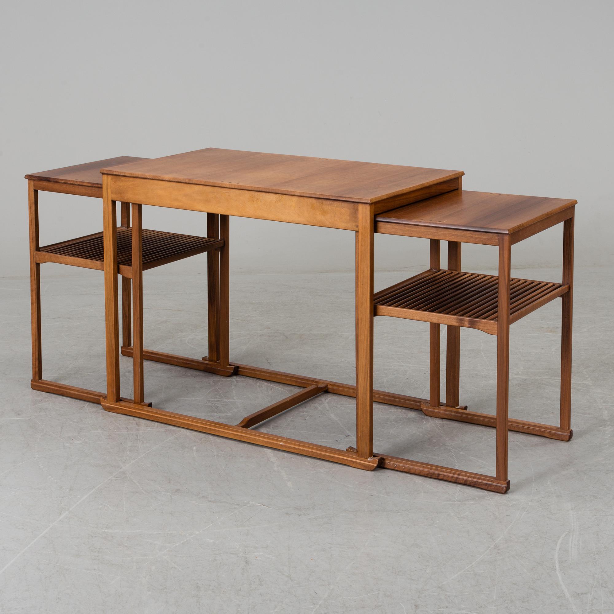 CARL MALMSTEN, a 'Släden' nest of three mahogany tables.