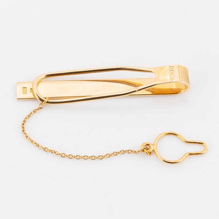 Patek Philippe, slipsnål och manschettknappar.