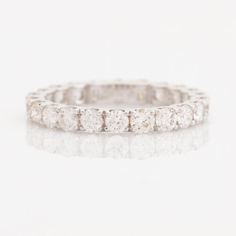 Brilliant-cut diamond eternity ring.