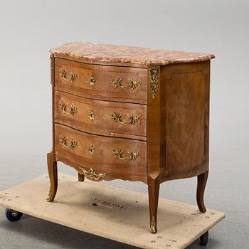 A rococo style chest of drawers.
