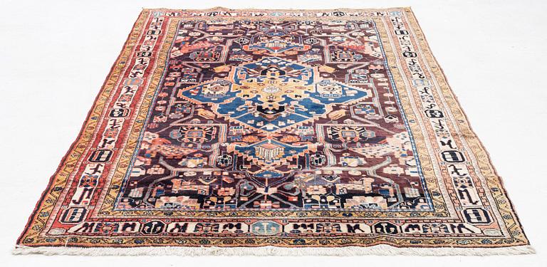 An oriental rug, c. 300 x 155 cm.