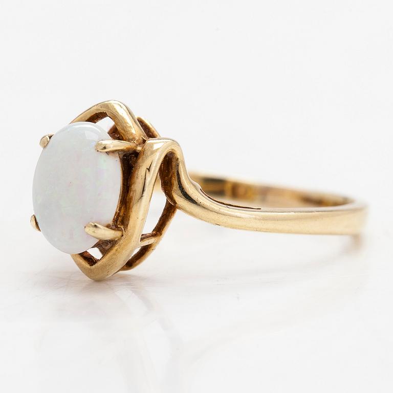 A 14K gold ring with an opal.