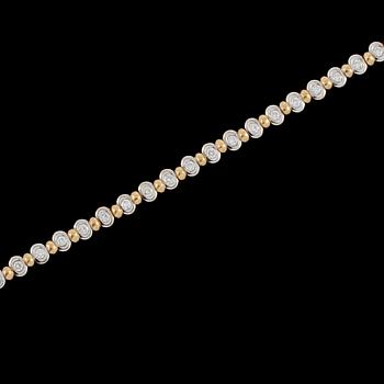 ARMLÄNK, 18k guld och vitguld med 30 briljantslipade diamanter, ca 1.20 ct, Italien, 1900-talets slut.  Vikt 19 g.