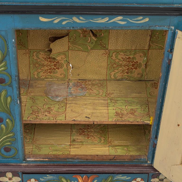 A 19th century folk art hanging cabinet.