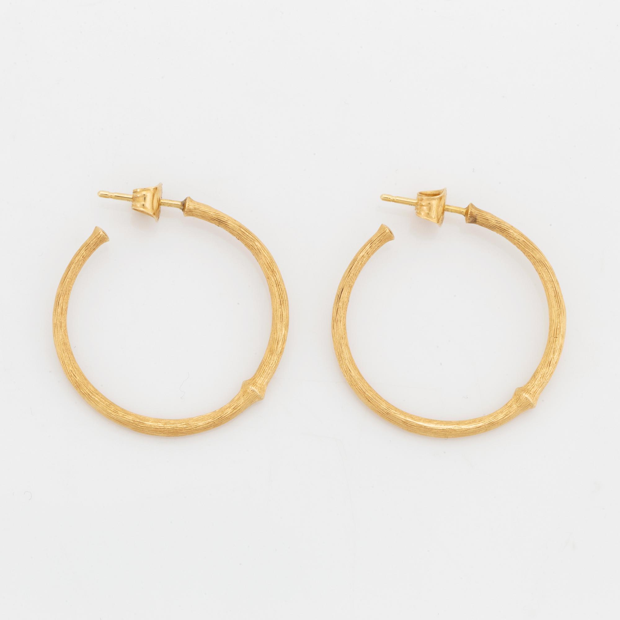 Ole Lynggaard, 18K gold earrings.