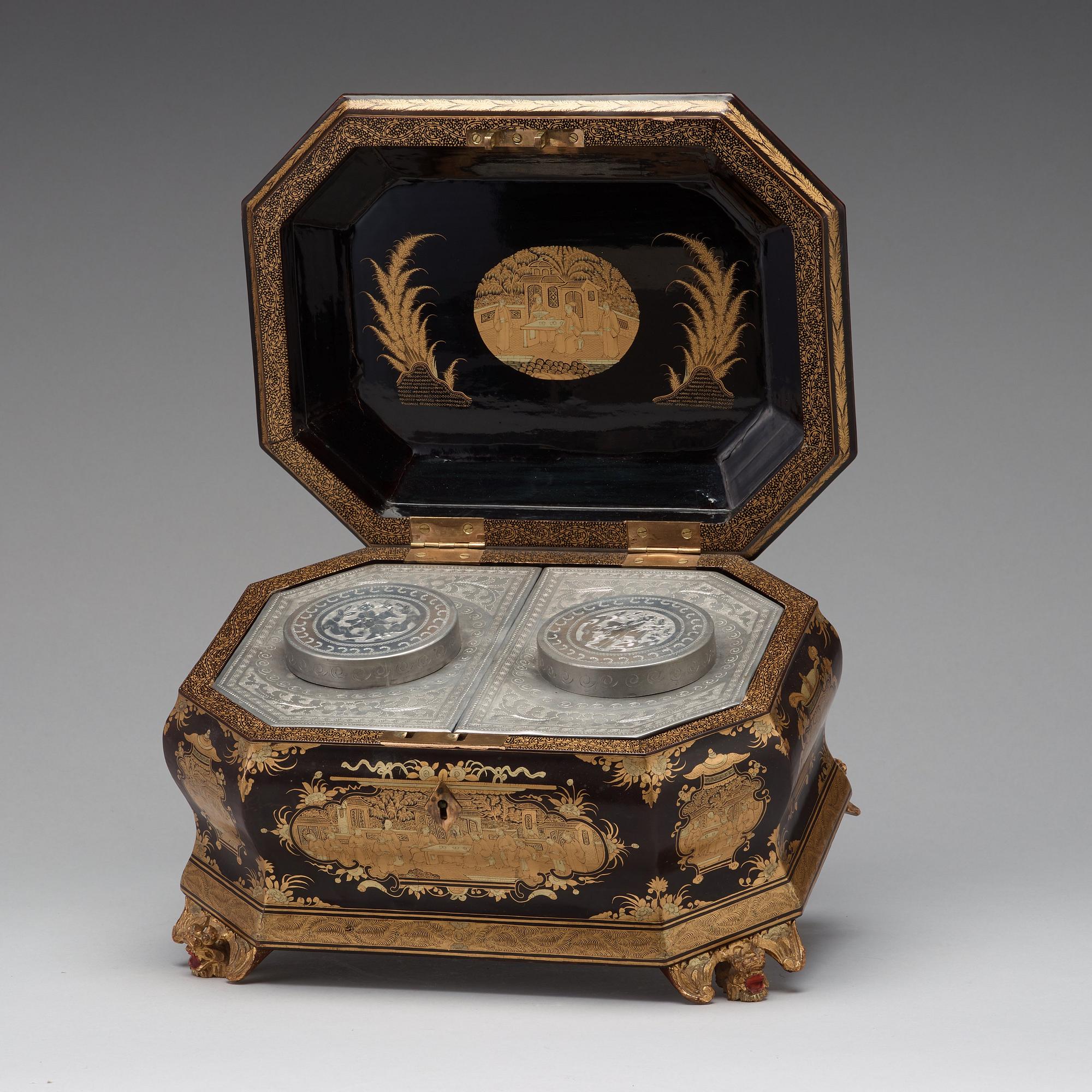 A lacquered tea box with pewter canisters, Qing dynasty, late 19th Century.