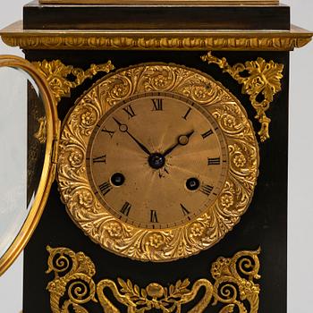 An Empire-style late 19th century mantel clock.