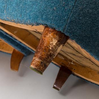 A pair of mid-20th-century armchairs.