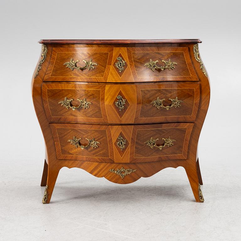 A Rococo style chest of drawers, mid-20th century.