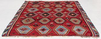 An antique/semi-attique kelim carpet, c. approx. 320 x 222 cm.