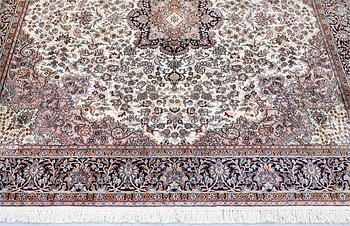 A Kashmir silk rug, approx. 215 x 212 cm.