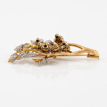 A W.A. Bolin brooch in 18K gold with enamel details and rose-cut diamonds.