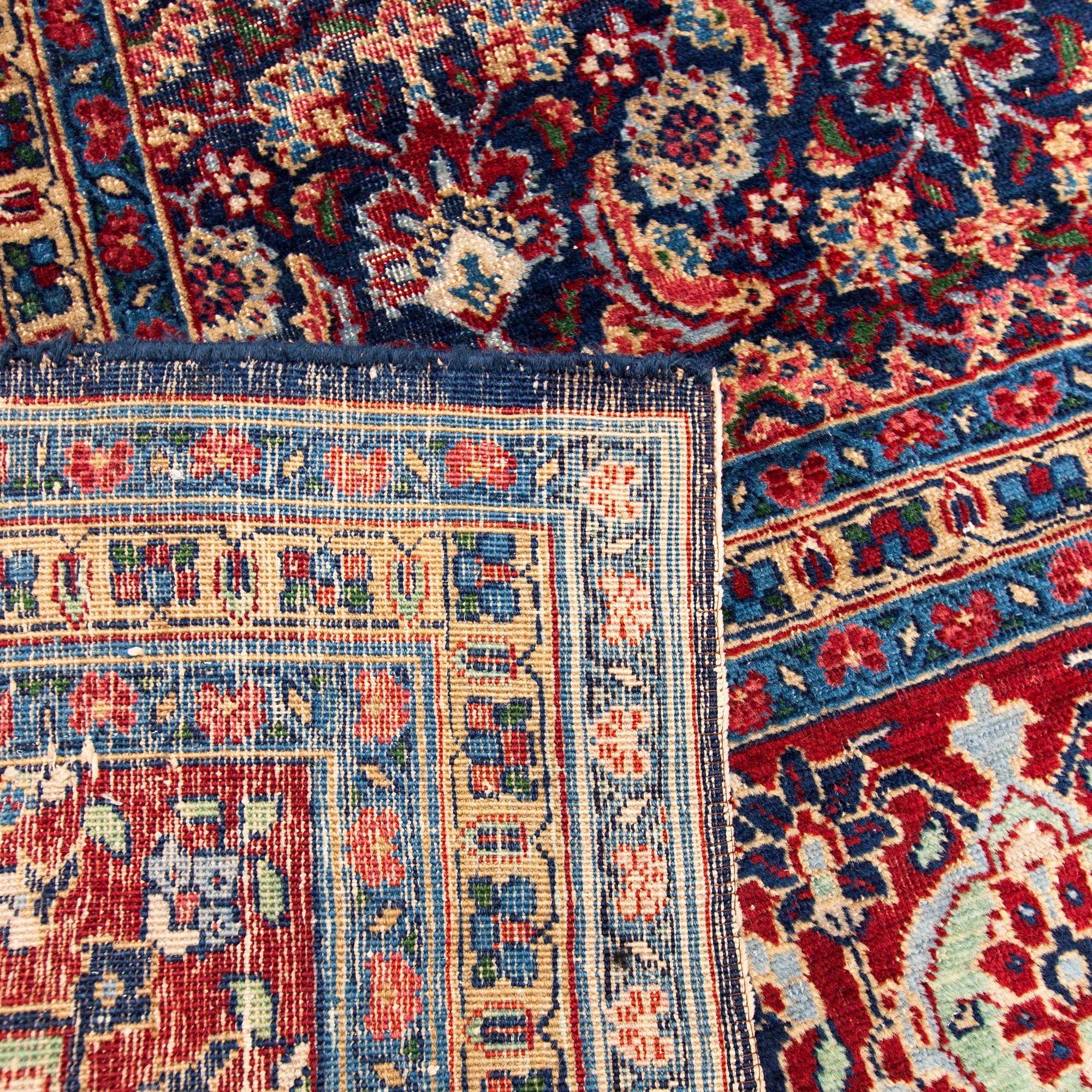 A carpet, a semi-antique Tabriz, ca 357 x 255 cm.