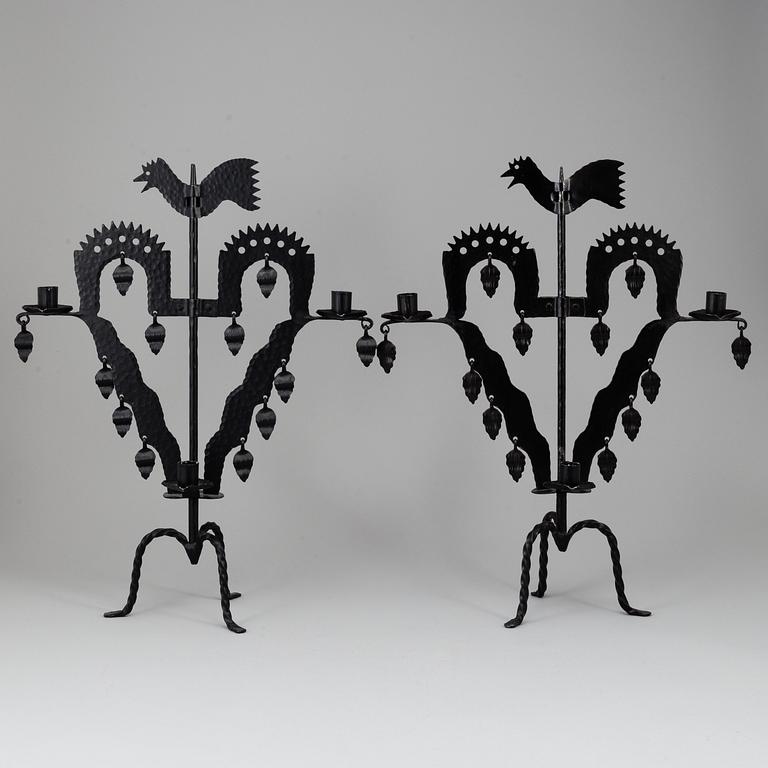 KANDELABRAR , 2 st smide, "Tuppljusstake" Design Gustaf Ancarkrona, Käck & Hedbys, Leksand.