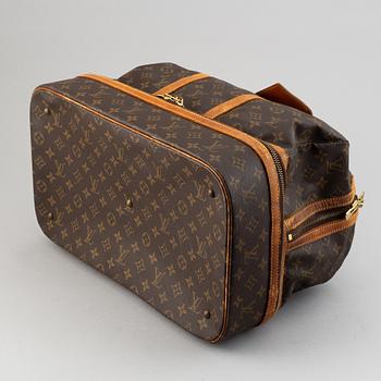 Louis Vuitton, a monogram canvas weekend bag.