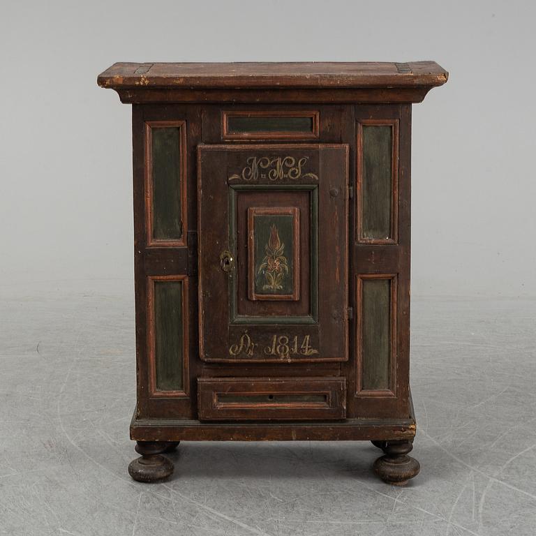 A painted cabinet, marked 1814.