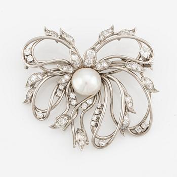 A brooch in palladium set with a half pearl and eight-cut diamonds, W.A. Bolin.